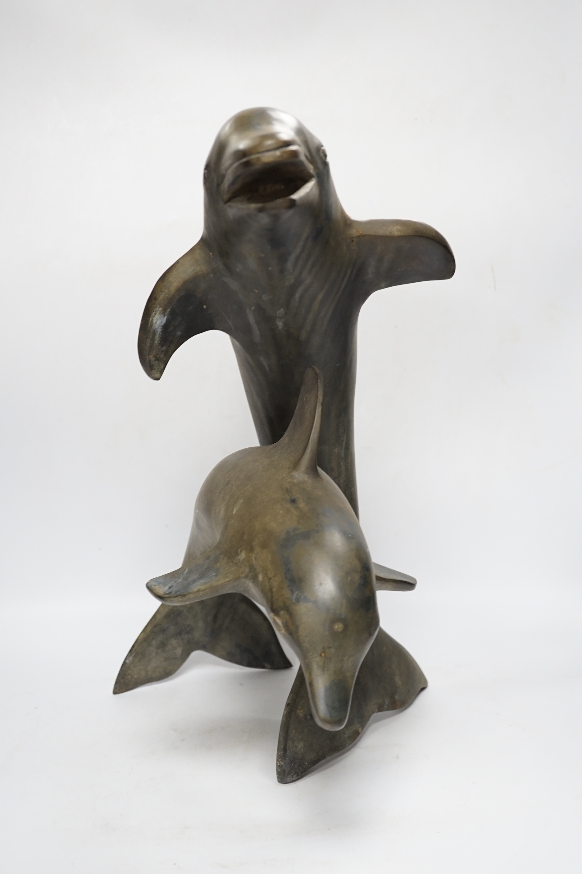 A hollow cast bronze dolphin group, 48cm